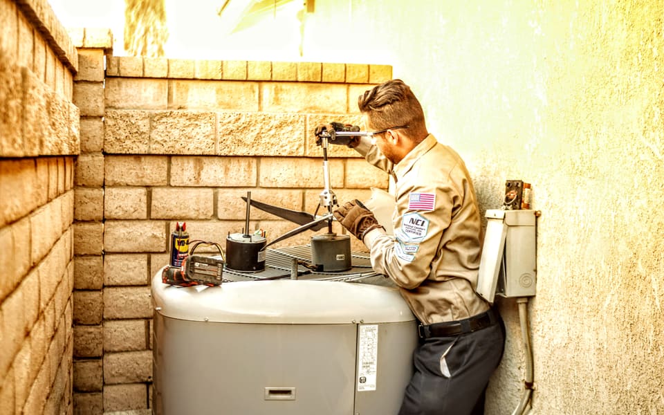 American Cool technician checking a residential packaged HVAC unit