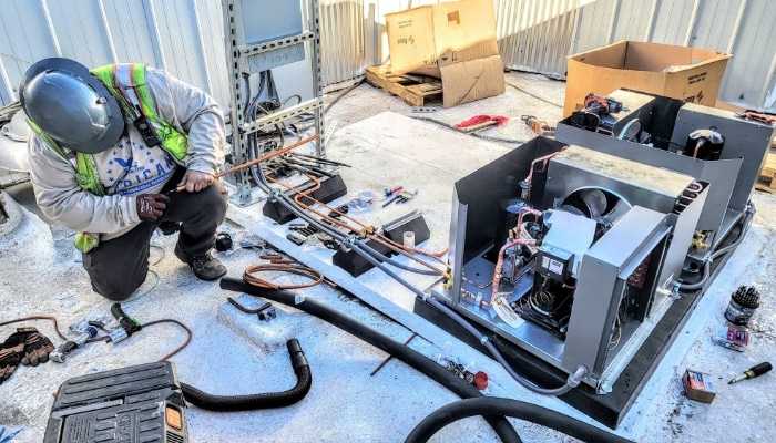 American Cool Working On Refigeration Line Commercial Installation