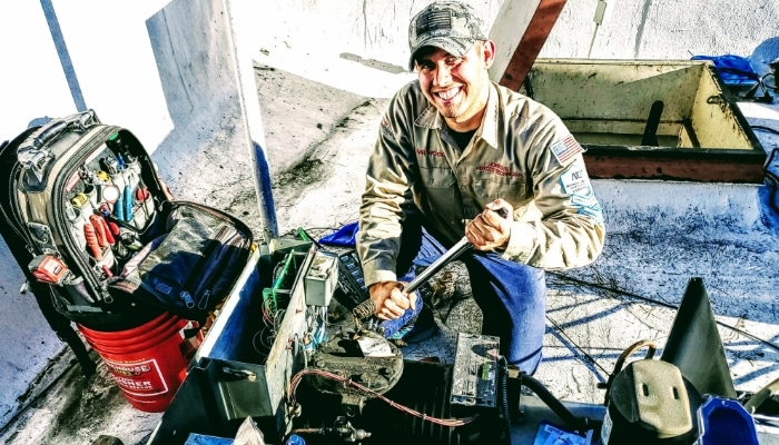 Smiling Technician With All Gear